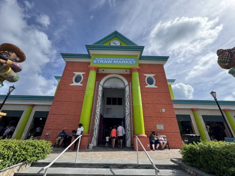 Entrance to the Nassau Straw Market with colorful stalls and signage welcoming visitors to the downtown shopping area