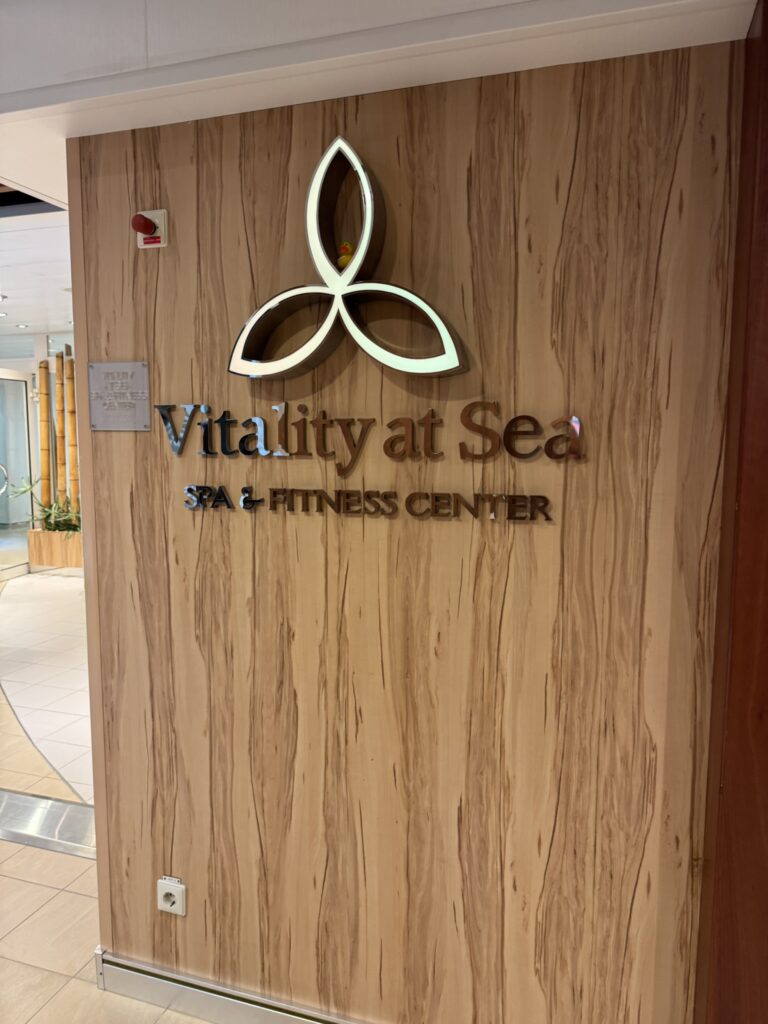 Spa entrance sign on the cruise ship, highlighting a relaxing option for a birthday cruise celebration.