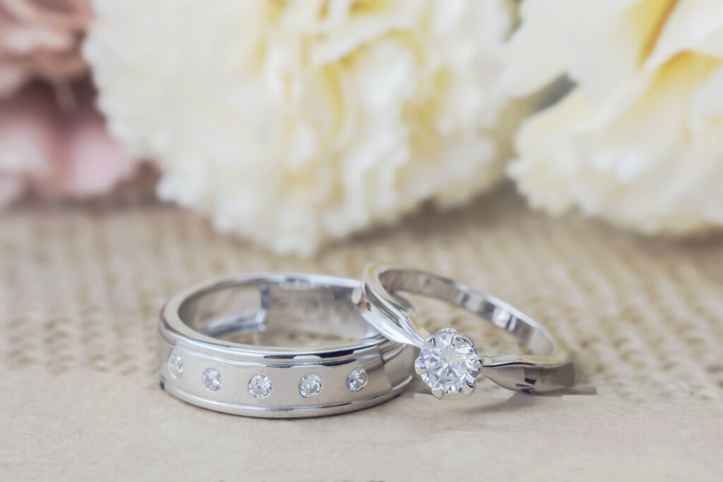 Close‑up of wedding rings on a table, symbolizing the start of a new life together and anchoring the cruise wedding guide.
