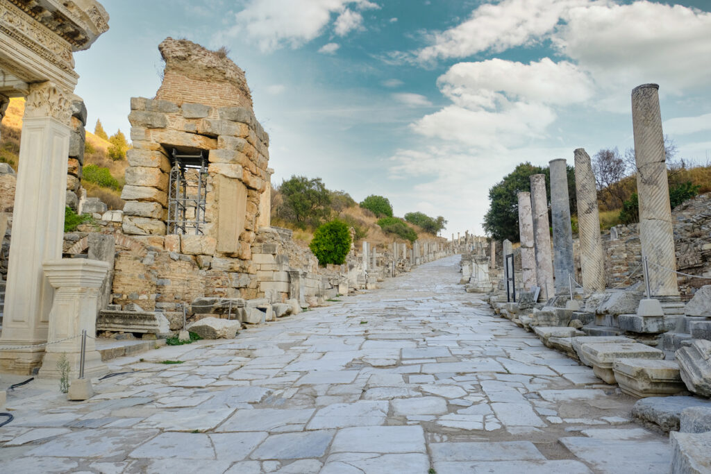 Curetes street in Ephesus Ancient City at sunny day in Izmir, Turkey - October, 2020: Ancient and historical road from the roman period.