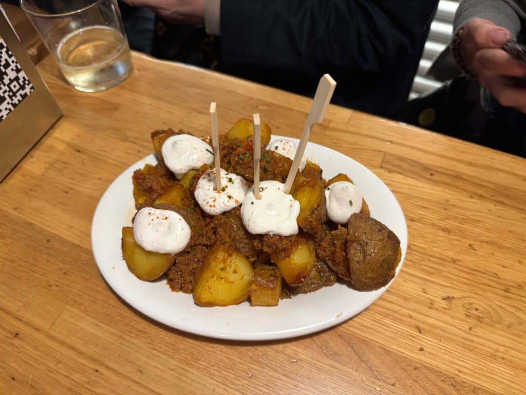 Appetizer served during a food tour in Barcelona, featuring a small plate of local Catalan bites that highlight the flavors and traditions explored on the tour.