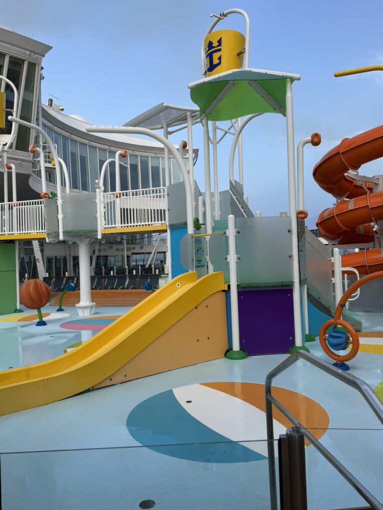 Kids’ splash area on Oasis of the Seas with colorful water features and no children present, featured in the Oasis of the Seas guide.