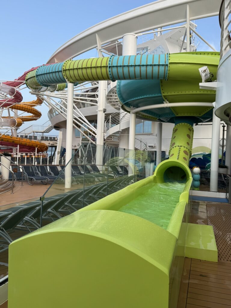 Empty waterslide exit on Oasis of the Seas with bright colors and no riders.