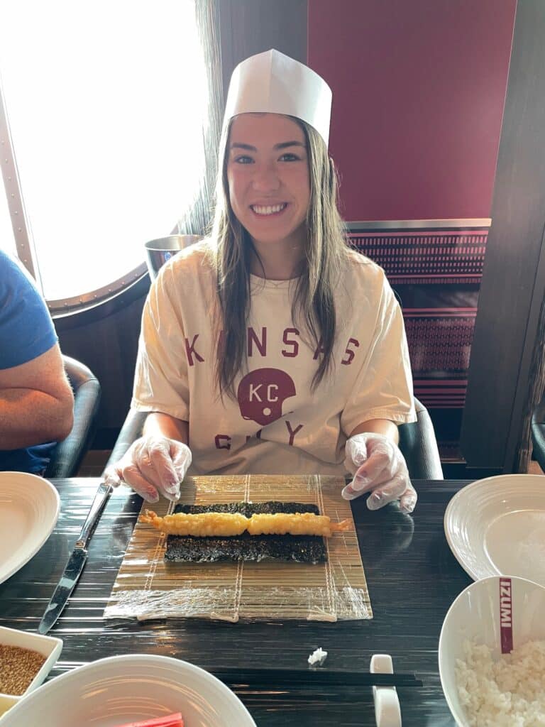 making a sushi roll at izumi on royal caribbean