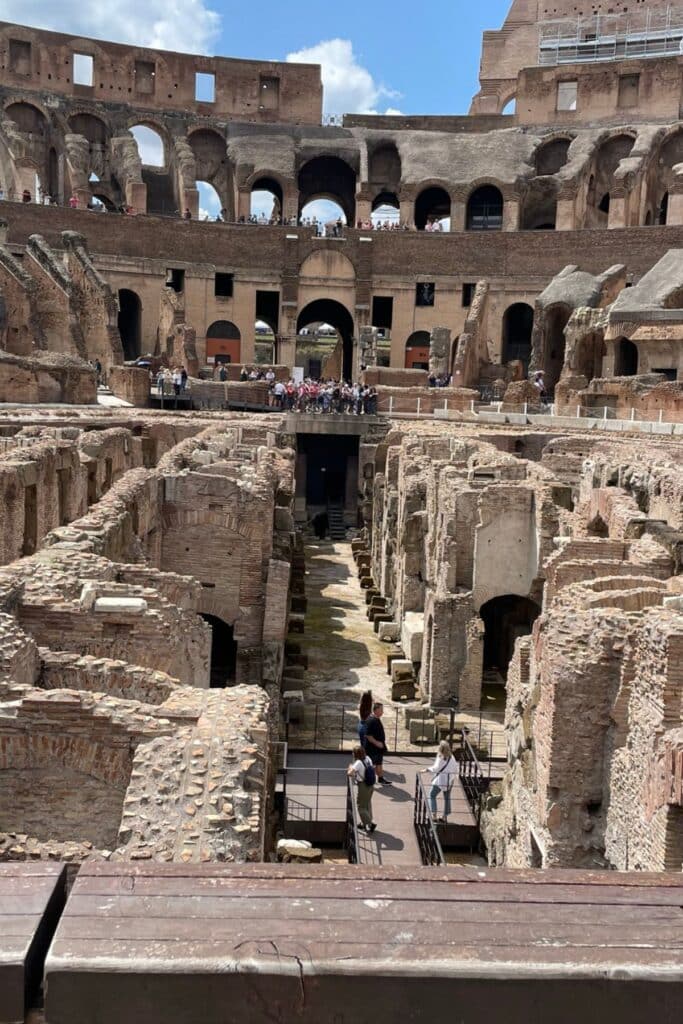 Interior view of the Colosseum in Rome, showcasing ancient stone arches and historic architecture for a post focused on cruise‑friendly historic landmark tips.