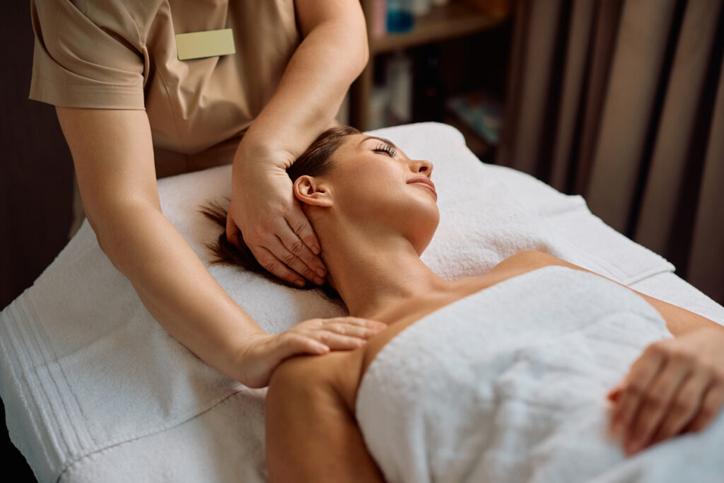 Woman receiving a relaxing massage during luxury spa treatments at sea, highlighting the pampering experience featured in the “luxury spa treatments at sea” guide.