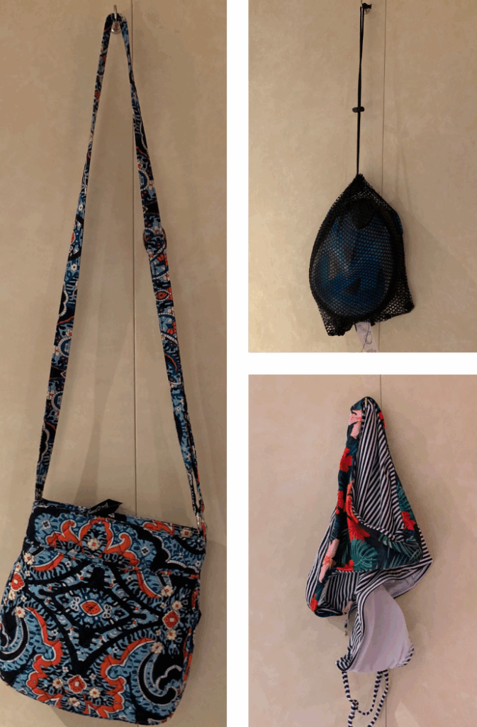 magnetic hooks for cruise cabin walls, shown with a purse, a snorkel/bag and a swimsuit.