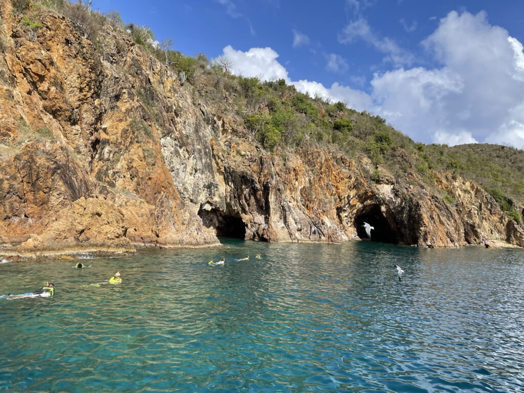 Calm turquoise water and soft sand at Smuggler’s Cove on Tortola, a quiet and secluded Caribbean beach