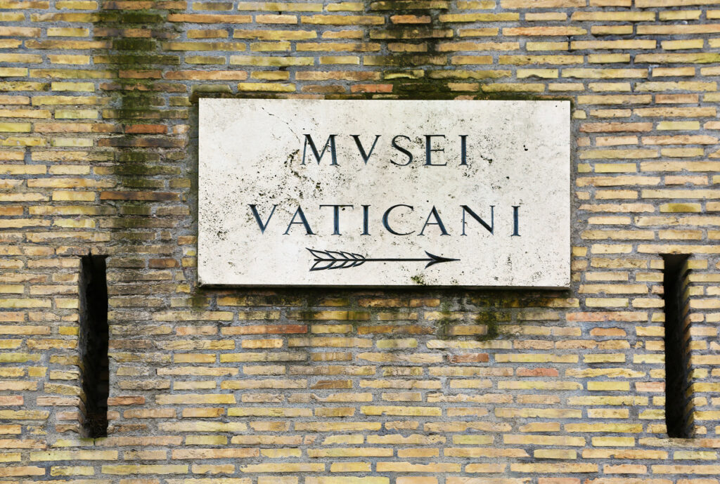 sign to Vatican museums in Rome, Italy