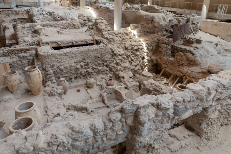 Pottery artifacts in the ruins of prehistoric Akrotiri settlement, Santorini island, Greece