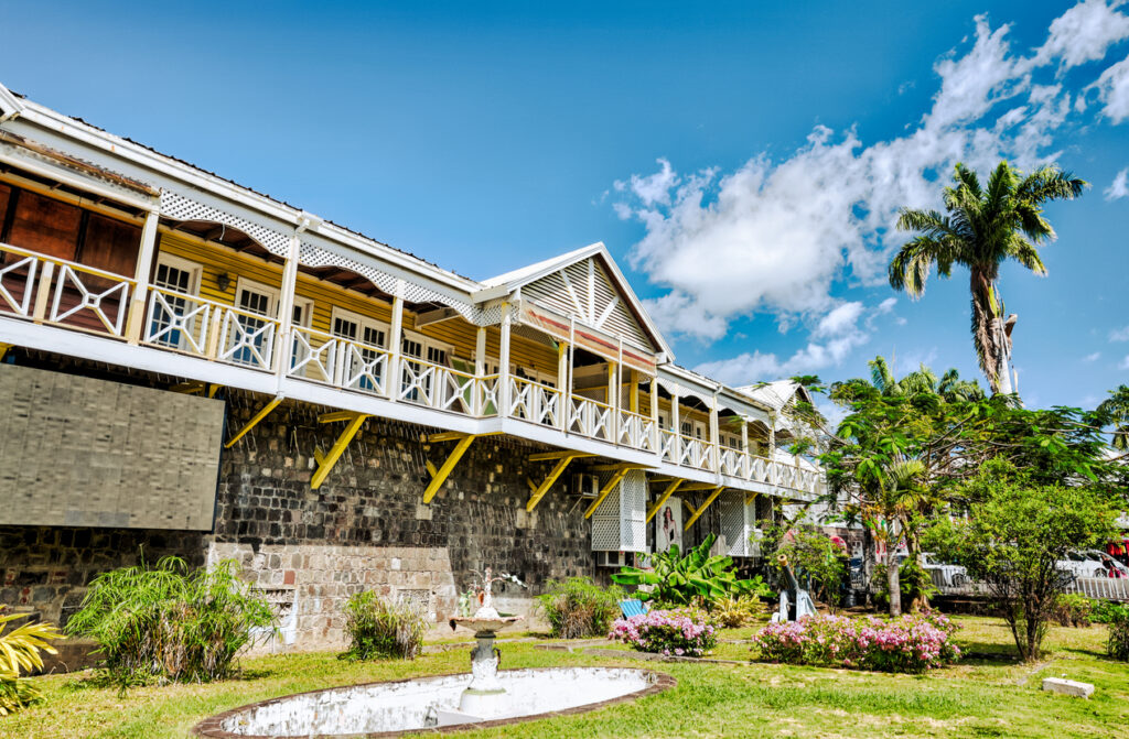 Tropical buildings and colorful street views in Basseterre, St. Kitts, showcasing the scenery near the cruise port.