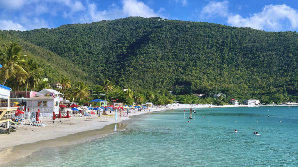 Scenic view of Cane Garden Bay on Tortola with calm turquoise water, soft sand, and a relaxed Caribbean beach atmosphere