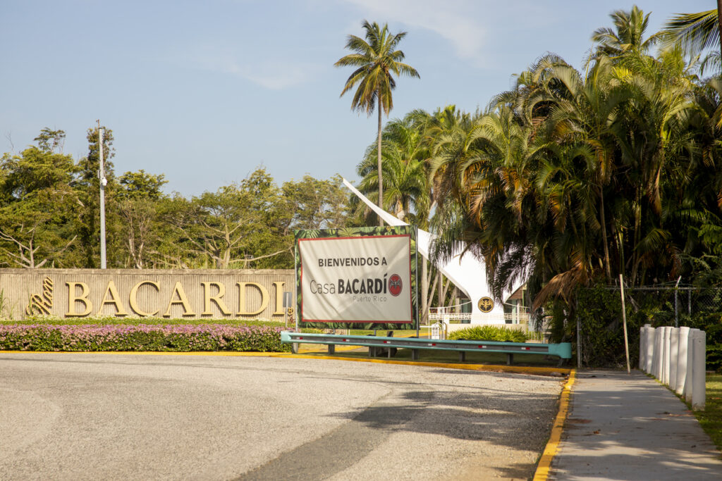 Casa Bacardí Rum Distillery in San Juan, Puerto Rico, featuring the iconic bat logo, modern visitor center, and outdoor tasting areas.