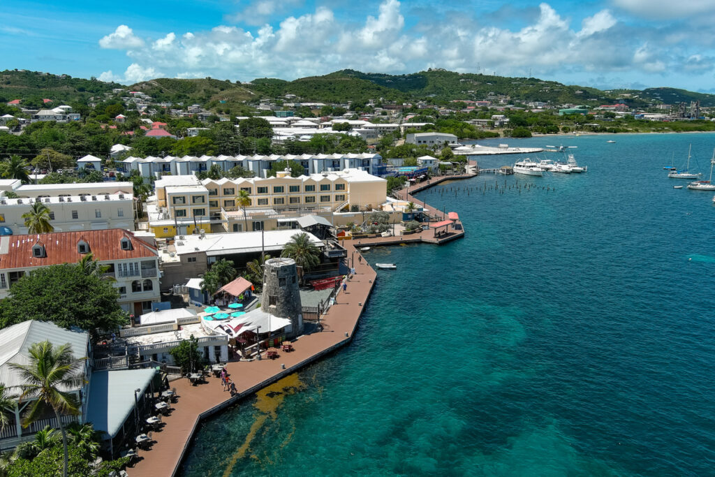 Aerial view of the Christiansted Boardwalk with boats anchored along the harbor in St. Croix.
