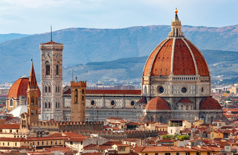 Exterior of Florence Cathedral with its white, green, and pink marble façade.