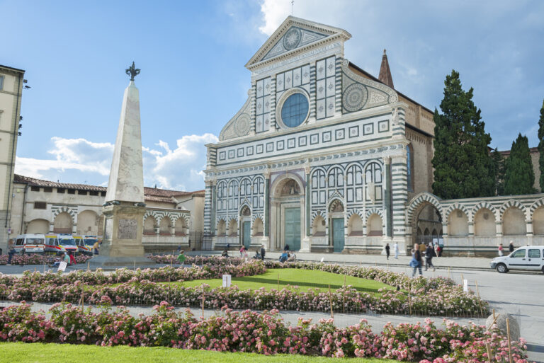 Exterior of the Basilica of Santa Maria Novella with its white‑and‑green marble façade.