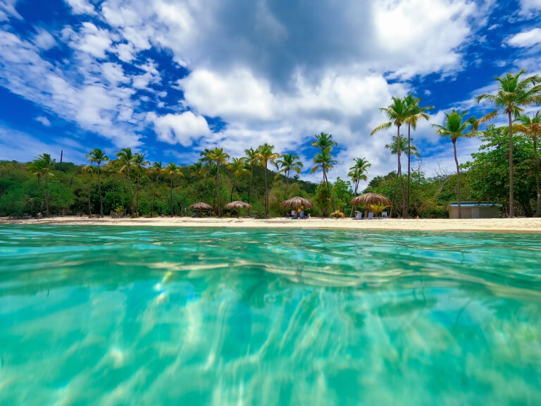 Calm turquoise water and soft sand at Honeymoon Beach on Water Island in the US Virgin Islands.