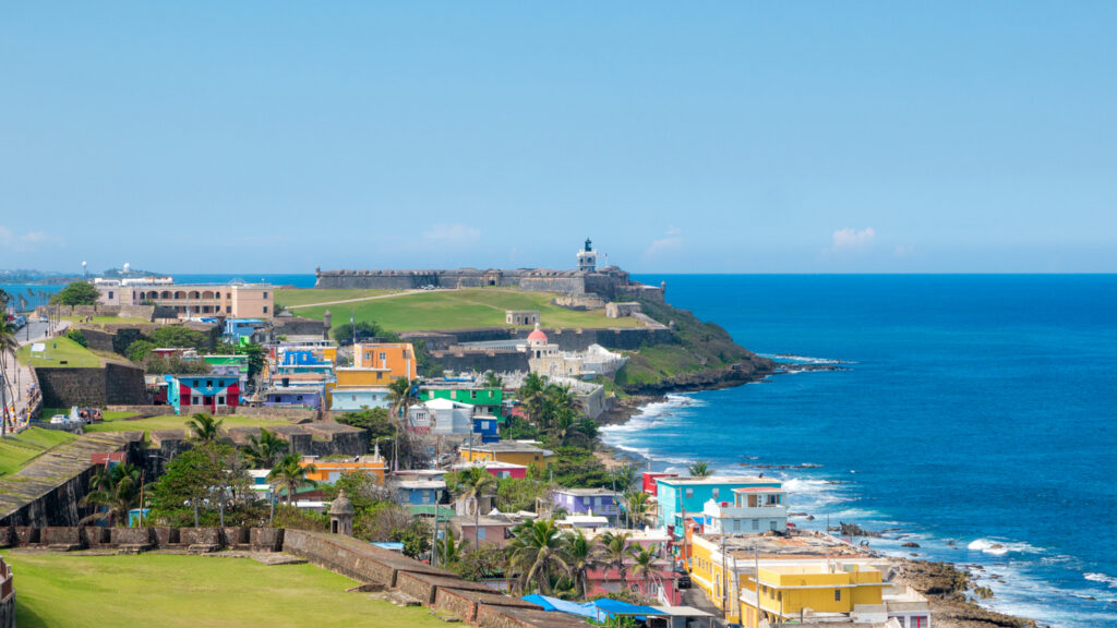 Colorful homes of La Perla along the coastline of Old San Juan, Puerto Rico, viewed from the historic city walls.