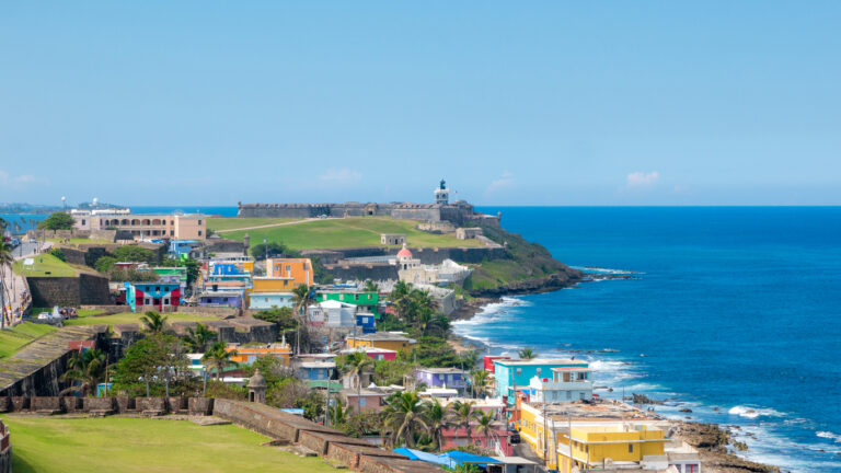 Colorful homes of La Perla along the coastline of Old San Juan, Puerto Rico, viewed from the historic city walls.