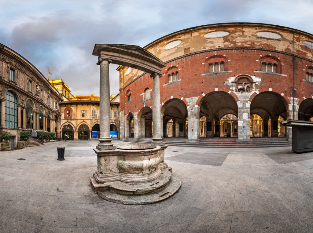 Panoramic morning view of Palazzo della Ragione and Piazza dei Mercanti in Milan, Italy.