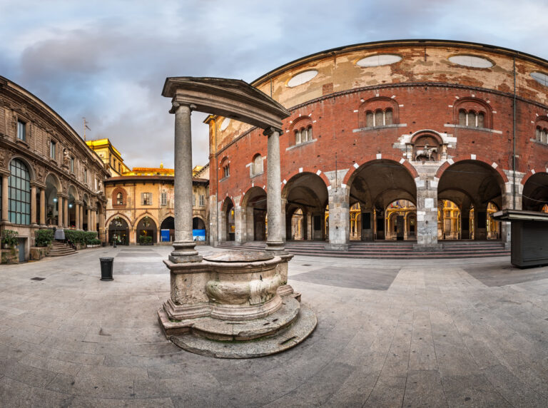 Panoramic morning view of Palazzo della Ragione and Piazza dei Mercanti in Milan, Italy.