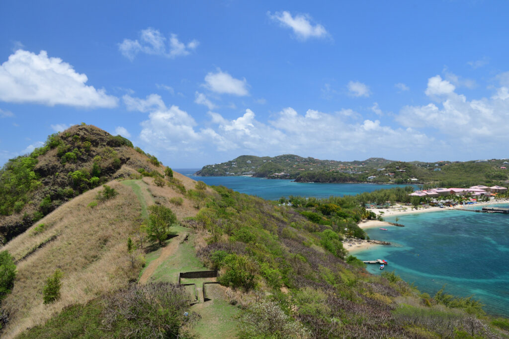 View from Pigeon Island National Park showing historic stone ruins, coastal trails, and sweeping views over Rodney Bay in St. Lucia.
