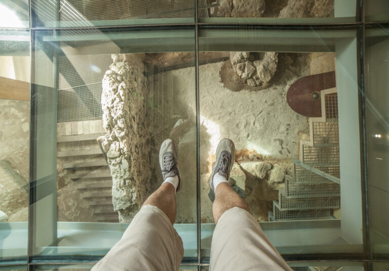 Cartagena, Spain - Glass floor of Punic Wall Interpretation Center. Visitor view under his feet