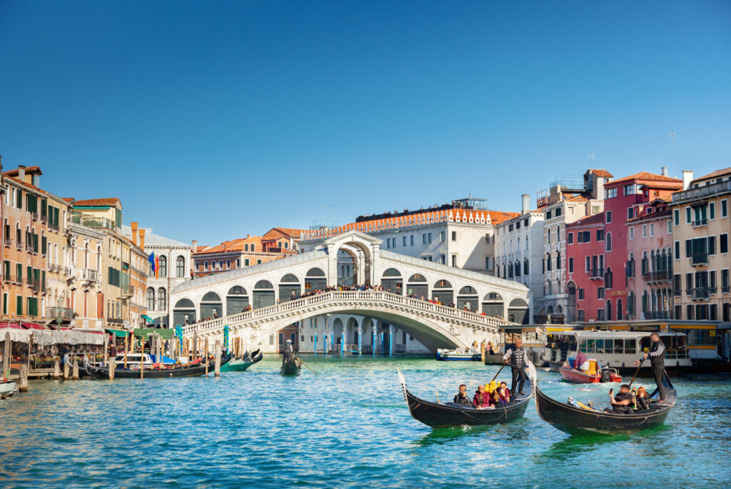 View of the Rialto Bridge spanning the Grand Canal in Venice, Italy.