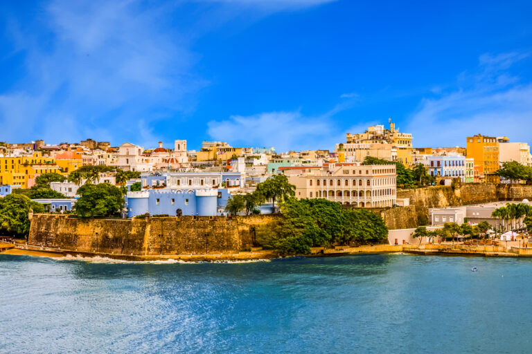 Colorful coastal buildings along the waterfront in San Juan, Puerto Rico, on a bright sunny day.