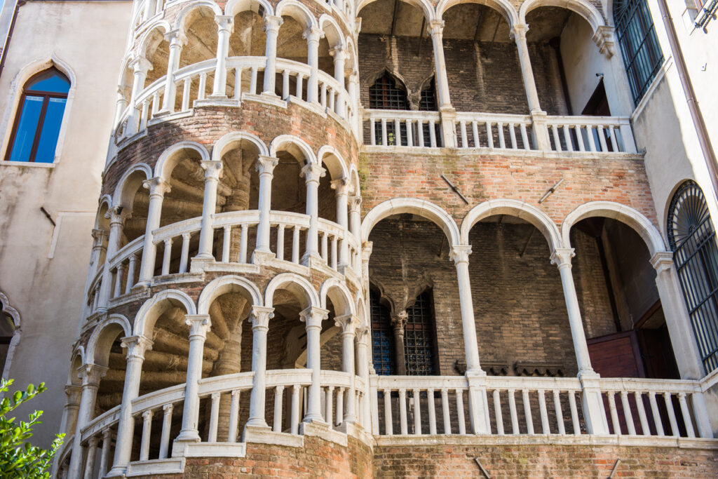Exterior view of Scala Contarini del Bovolo with its spiral staircase and arches in Venice, Italy