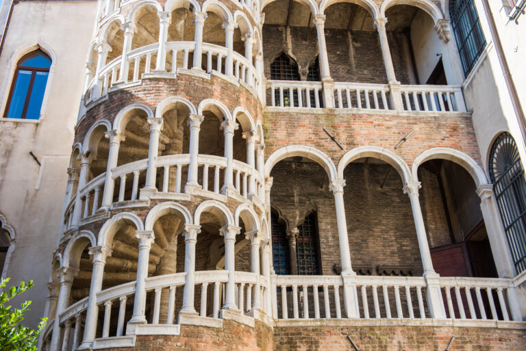 Exterior view of Scala Contarini del Bovolo with its spiral staircase and arches in Venice, Italy