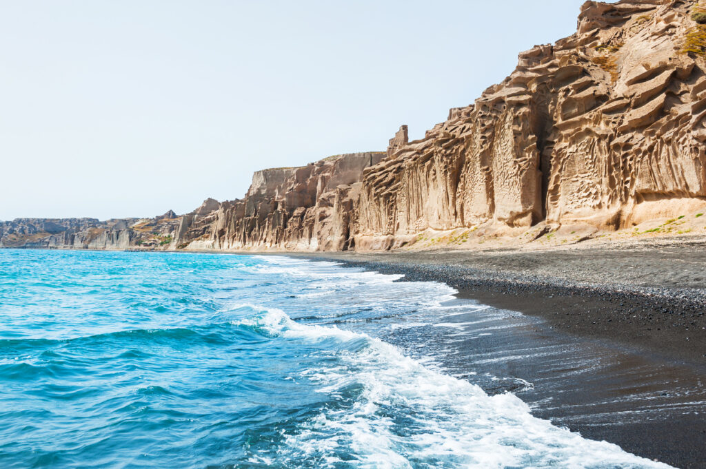 Beautiful beach with white volcanic mountains and turquoise water. Vlychada beach, Santorini island, Greece