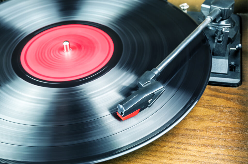 Vinyl record spinning on a retro turntable, symbolizing Jamaica’s rich musical heritage