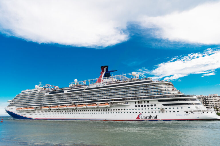 Carnival Horizon cruise ship departing the Port of Miami on embarkation day under a clear summer sky