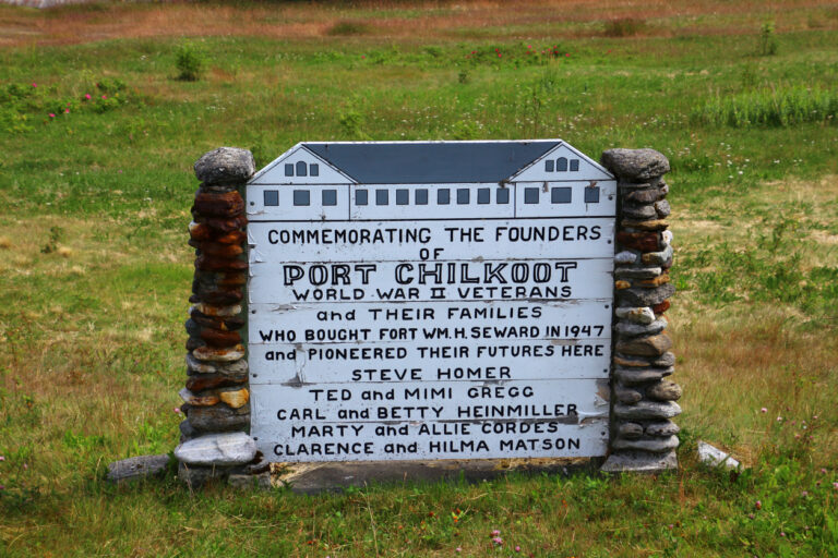 Historic commemorative sign at the former site of Fort William H. Seward in Port Chilkoot, Haines, Alaska, honoring the WWII veterans and families who helped shape the community.