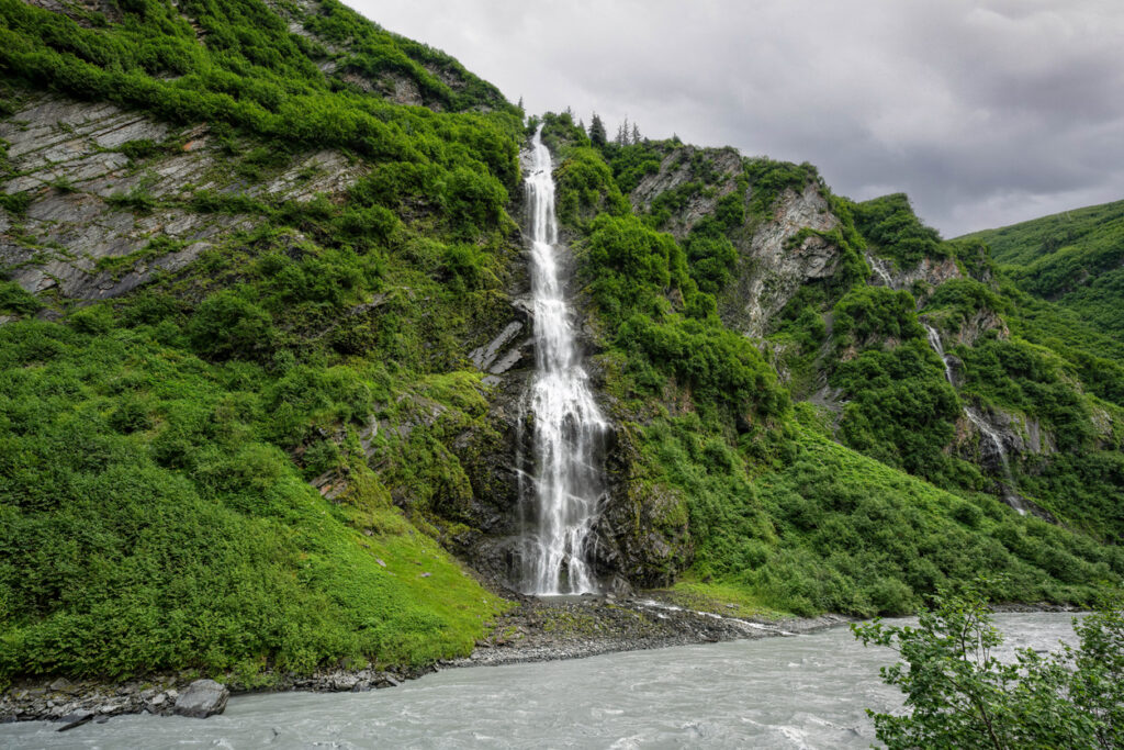 Bridal Veil Falls cascading down the steep canyon walls along the Richardson Highway in Keystone Canyon near Valdez, Alaska.
