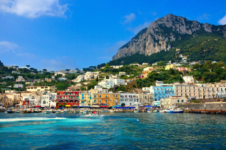 Marina Grande harbor in Capri with colorful buildings and boats along the waterfront