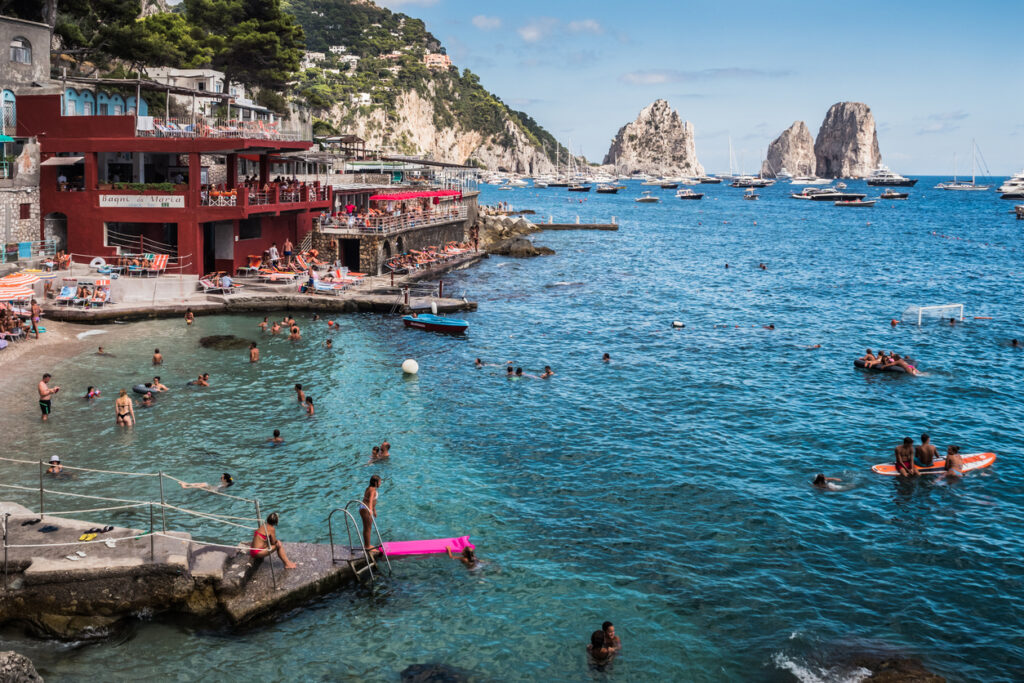 Marina Piccola cove in Capri with turquoise water and views of the Faraglioni rock formations