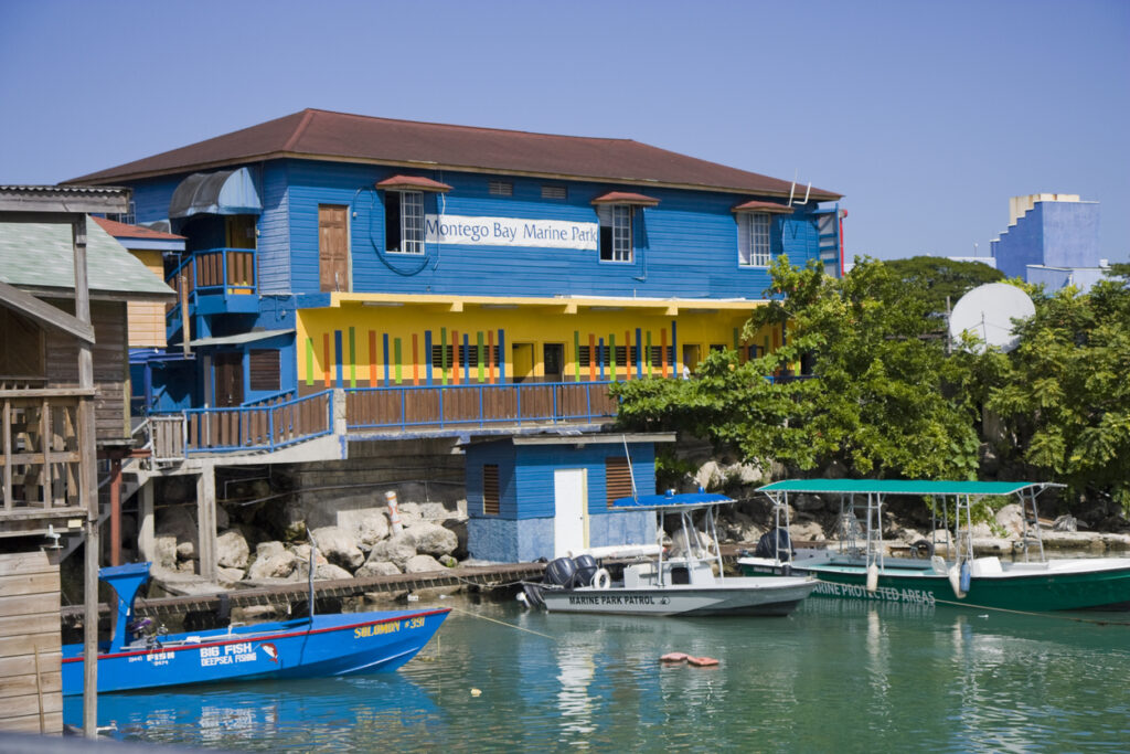 Marine Park patrol boat docked along the protected shoreline in Montego Bay, Jamaica, highlighting the conservation zone within the Montego Bay Marine Park