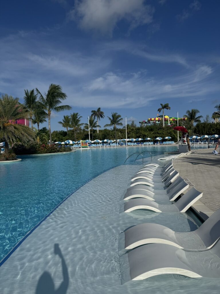 Lounge chairs at Oasis Lagoon on Perfect Day at CocoCay, showing what to expect at CocoCay during a relaxing beach day