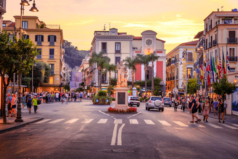 Colorful buildings and outdoor cafés surrounding Piazza Tasso in Sorrento