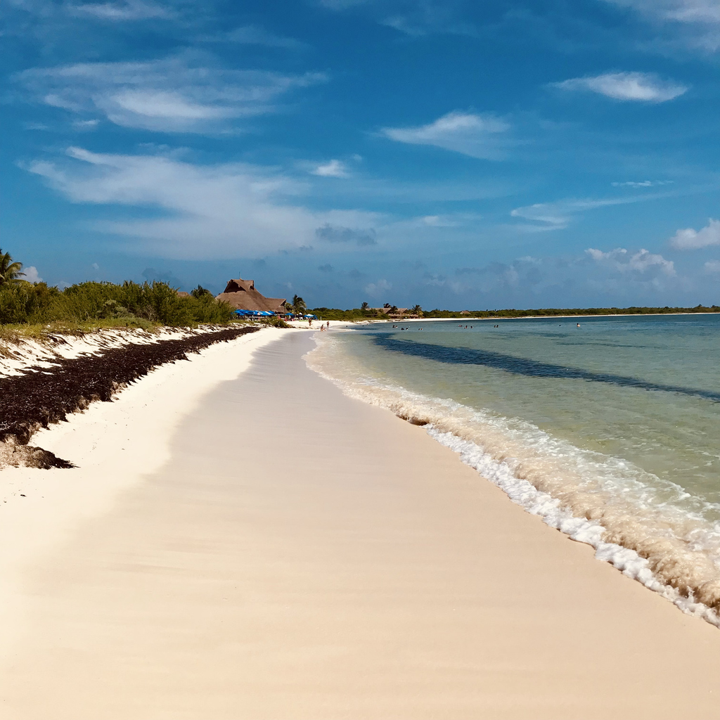 Pristine white‑sand beach with turquoise water at Punta Sur Eco Beach Park