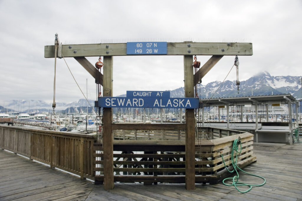 A wooden sign at the Seward Harbor used for displaying the day’s catch, part of the fishing culture along Alaska’s Resurrection Bay.