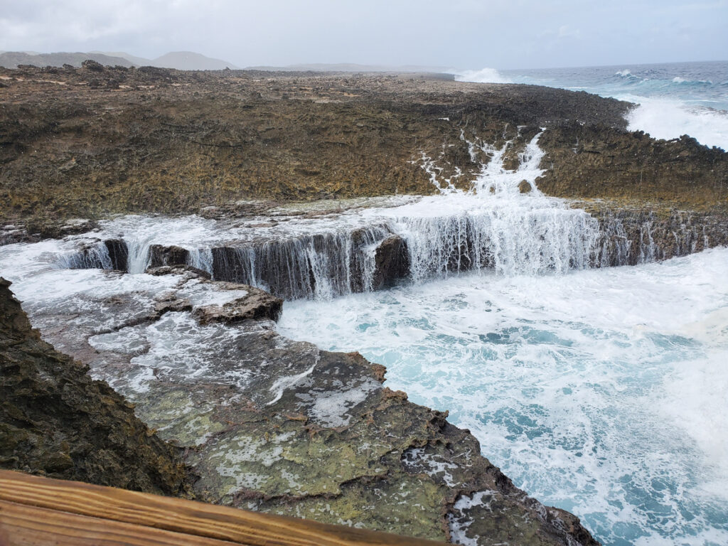 Rocky coastline at Shete Boka National Park with powerful waves breaking against the cliffs on Curaçao’s northern shore
